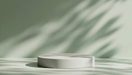 Round podium on a smooth light green surface with delicate leaf shadows on wall, natural product display background for eco-friendly presentation and botanical branding.