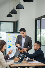 Group of business people stand to present their work, explaining about investment business.	