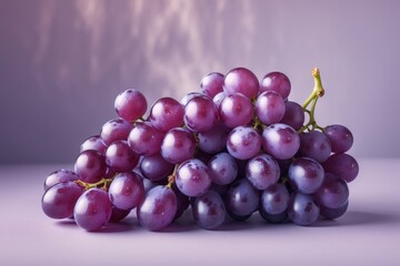 Fototapeta premium Vibrant Bunch of Purple Grapes Isolated on a Light Surface