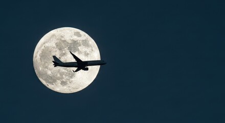 Airplane crossing the full moon on a dark sky night background