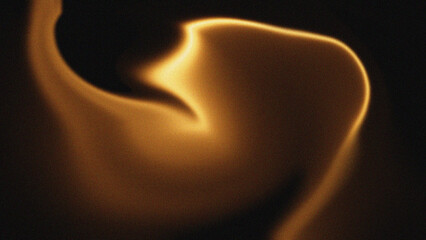 Abstract golden flame shape against dark background
