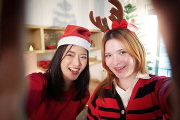 Joyful Christmas Selfie with Friends in Festive Outfits