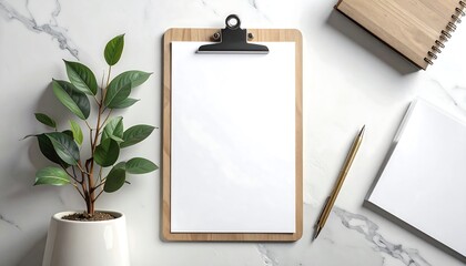 Elegant workplace setup featuring a clipboard, plant, and office supplies on marble