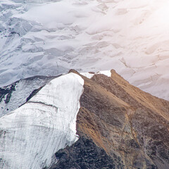 A close-up of a mountain peak in bad weather, leading to the death of climbers in windy weather, snow-capped peaks in the clouds