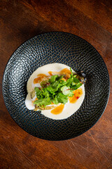 A delightful culinary creation featuring vibrant herbs and sauces presented beautifully