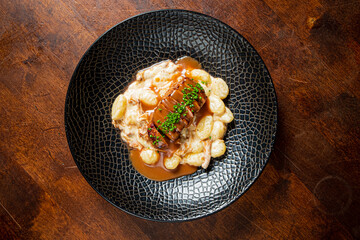Savory meat accompanied by rich sauce and pillowy dumplings creates a culinary delight