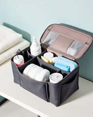 Organized Fabric Storage Bin with Essential Items for Home or Travel Convenience