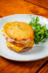 Savor the taste of a staggered hash brown creation filled with melted cheese and herbs