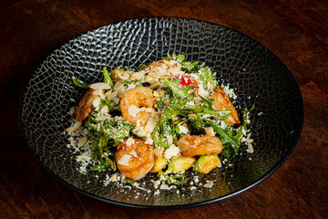 Succulent shrimp tossed with vibrant greens, topped with crunchy almonds and cheese