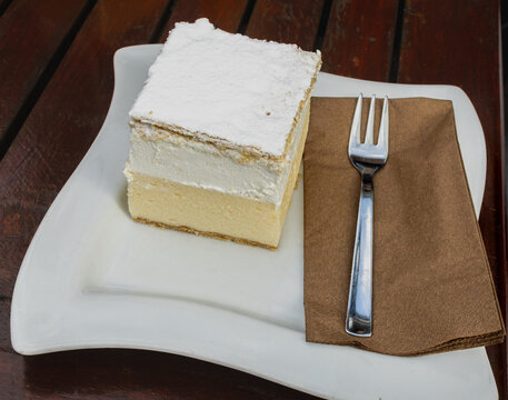 Vanilla Slice creamy, Bled cream cake, (Blejska kremsnita, rezina ) Cremeschnitte,- Bled, Slovenia. It is a cake consisting of two puff pastry sheets filled with vanilla
