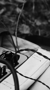 Historical Re-enactment Black And White Video. Russian Soviet Infantry Red Army Soldier In World War II using Russian Soviet Portable Radio Transceiver In Trench Entrenchment In Spring Autumn Forest