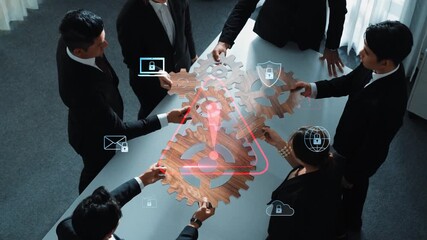 A diverse business team collaborates over a table with digital security symbols and gears, symbolizing teamwork, innovation, and strategic planning in a modern workspace. Raster - Powered by Adobe