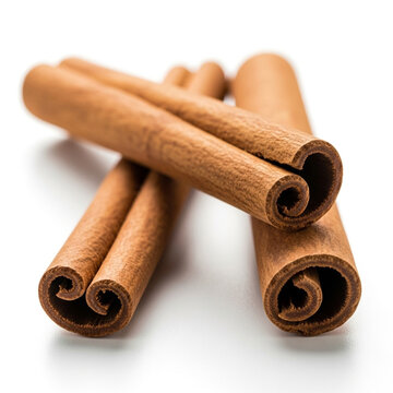 Close up of dried cinnamon sticks on a white background