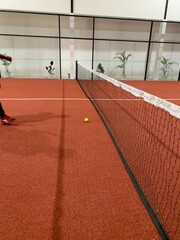 Paddle tennis balls of a red field rubber ground with white lines outdoors, sports concept.
