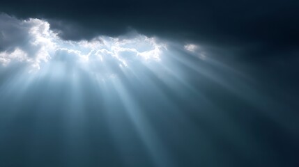 Fototapeta premium Dark storm clouds with dramatic sunlight rays breaking through