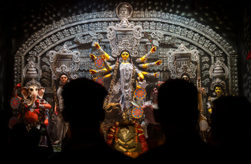 Devotees  throng to offer prayers to Goddess Durga at a pandal during Durga puja festival