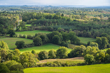 Scenic early autumn rural landscape with fields and trees in French countryside, Biron, Dordogne, France