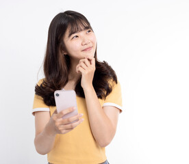 Young woman thinking, holding the smart phone