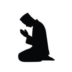 Black silhouette of a man praying in traditional attire kneeling