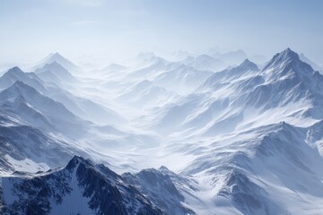 Obraz premium Majestic Snowy Mountain Range Under Clear Blue Sky with Soft Light and Misty Atmosphere for Inspirational Themes