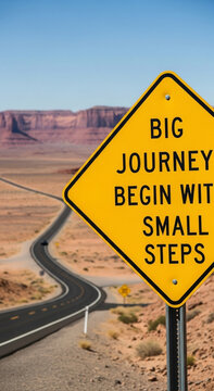 Yellow road sign with inspirational quote big journey begin with small steps in desert landscape