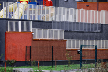 Fencing of the courtyard of an apartment building on an autumn day