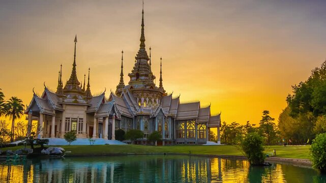 Timelapse of Wat Non Kum or Wat Luang Pho To in Sikhio District, Nakhon Ratchasima, Korat, Thailand is a symbolic place of temples in Thailand. At sunset, there is a reflection in the water.