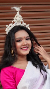 Beautiful smiling Indian bengali bride dressed in Hindu traditional wedding clothes Saree. Indian, Bengali or Kolkata wedding ritual Briddhi look concepts. close up face.