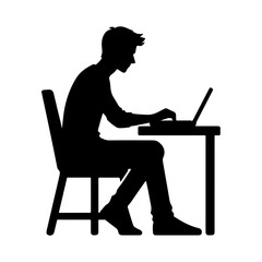 Silhouette of a man working on a laptop at a desk