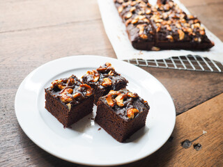 brownies with chocolate ganache cream and cashew nuts