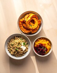 Fototapeta premium Roasted squash, grain bowls, healthy autumn dinner