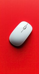 White computer mouse on solid, vibrant red background