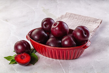 Raw ripe purple plum heap