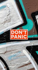 Urban Graffiti Art with Dont Panic Message Painted on Textured Wall Close Up