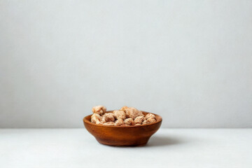 Small wooden bowl filled with cereal and fruit
