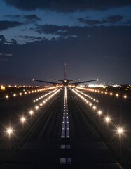 Airplane on runway at dusk