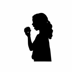 Silhouette of a girl eating an apple isolated on white background