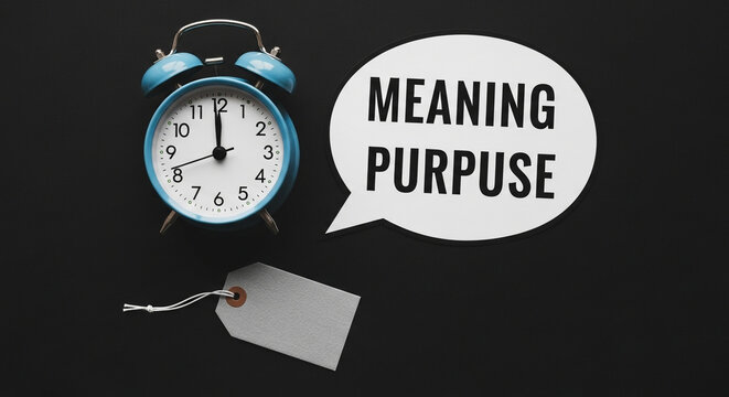 Alarm clock and speech bubble with meaning and purpose text on black background