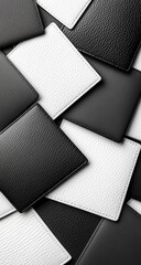 Tiled black & white squares, textured surface, angled pile