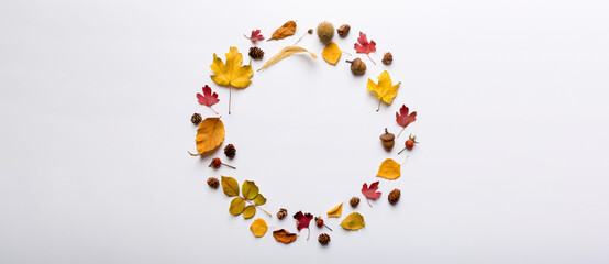 Autumn composition made of dried leaves, cones and acorns on table. Flat lay, top view, copy space