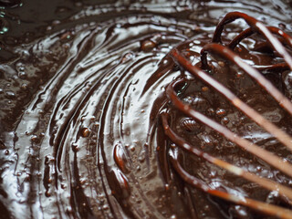 texture of brownie chocolate cake batter mixing with whisk