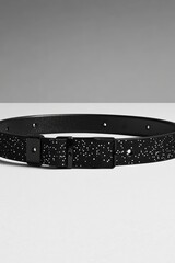 Black belt with white specks on white background