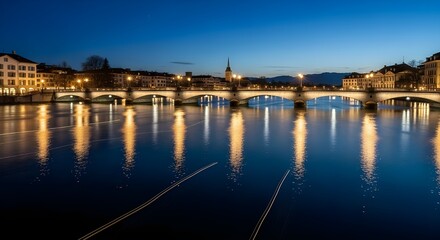 Obraz premium Cityscape with night lights reflecting on water Beautiful city view at night with illuminated buildings perfectly reflected on the calm water surface.