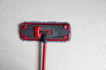 Cleaning tool for floors positioned on smooth surface ready for use in home or office cleaning activity
