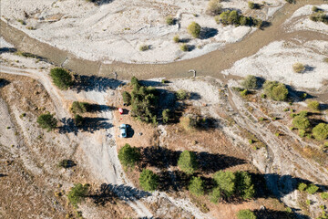 A lone campsite by a dry riverbed