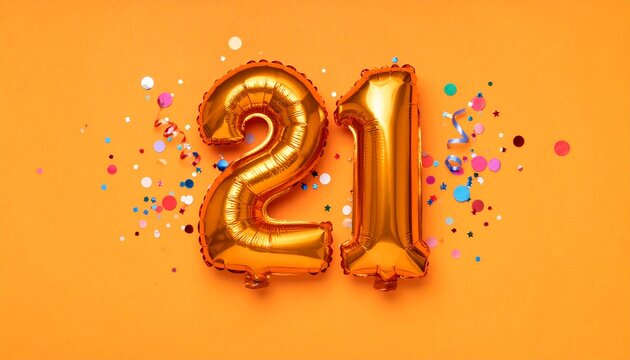 Orange balloon number 21 with confetti on solid colored background. Photo for anniversary or birthday party
