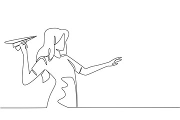 Obraz premium Continuous one line drawing a woman in casual clothes stands and holds a paper airplane. Get creative with origami paper. National Paper Airplane Day. Single line draw design vector illustration