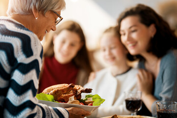 Family celebrating Thanksgiving Day