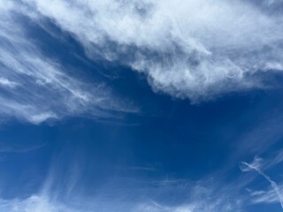 Fototapeta premium White fluffy clouds in blue sky.