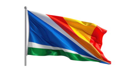 A colorful flag flutters gracefully on a pole against a solid black background, displaying multiple colors in a wave.